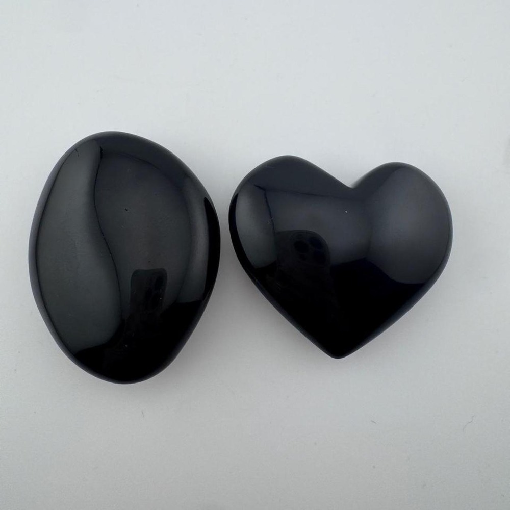 Black obsidian heart and oval shaped palm stones
